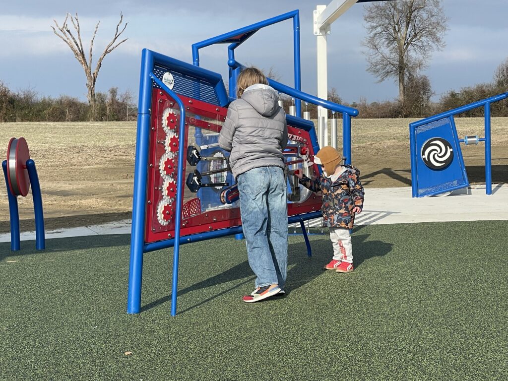 New playground layout. My kids, a decade apart in ages, enjoying the same accessible maze. 